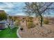 Landscaped backyard with artificial turf and mountain views at 1460 Tannery Hts, Mesquite, NV 89034