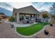 Large backyard patio with hot tub and mountain views at 1460 Tannery Hts, Mesquite, NV 89034