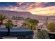 Landscaped backyard with a hot tub and mountain views at 1460 Tannery Hts, Mesquite, NV 89034