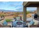 Covered patio with fire pit and mountain views at 1460 Tannery Hts, Mesquite, NV 89034