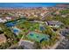 Aerial view of community amenities: pool, tennis courts, and basketball court at 1469 Dragon Stone Pl, Henderson, NV 89012