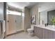 Modern bathroom featuring glass-enclosed shower, sleek vanity, and neutral color palette at 1469 Dragon Stone Pl, Henderson, NV 89012