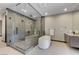 Luxurious bathroom boasts a soaking tub, a large shower, and elegant fixtures, promising relaxation at 1469 Dragon Stone Pl, Henderson, NV 89012