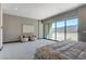 Bright bedroom featuring a large window with beautiful mountain views and comfortable seating at 1469 Dragon Stone Pl, Henderson, NV 89012