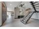 Bright foyer with a modern staircase, neutral tones, and contemporary decor, offering an inviting entrance at 1469 Dragon Stone Pl, Henderson, NV 89012