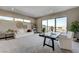 Modern living room with large windows, neutral walls, and plush carpeting at 1469 Dragon Stone Pl, Henderson, NV 89012