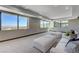 Bright living room with large windows and comfortable seating area at 1469 Dragon Stone Pl, Henderson, NV 89012