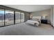 Expansive main bedroom with large windows and a balcony showcasing stunning views at 1469 Dragon Stone Pl, Henderson, NV 89012