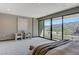 Serene main bedroom with large windows offering views of the hillside at 1469 Dragon Stone Pl, Henderson, NV 89012