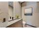 Stylish powder room featuring a modern sink, elegant mirror, and contemporary decor at 1469 Dragon Stone Pl, Henderson, NV 89012