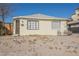 Charming yellow house with a small yard and seating at 203 N 13Th St, Las Vegas, NV 89101