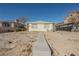 Simple yellow house with a small yard at 203 N 13Th St, Las Vegas, NV 89101