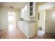 Kitchen with white cabinets and laminate floors at 203 N 13Th St, Las Vegas, NV 89101