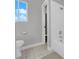 Simple bathroom with shower/tub combo, toilet, and a window at 204 Appian Way, Henderson, NV 89002