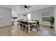 Bright dining room with a long wooden table and ten chairs at 204 Appian Way, Henderson, NV 89002