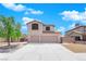 Two-story house with three-car garage and landscaped yard at 204 Appian Way, Henderson, NV 89002