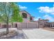 Two-story house with a three-car garage and mature tree at 204 Appian Way, Henderson, NV 89002