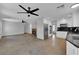 Open living room with fireplace and tile flooring, flows into kitchen at 204 Appian Way, Henderson, NV 89002