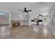 Open living area with a fireplace and tile flooring, looks into kitchen at 204 Appian Way, Henderson, NV 89002