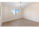 Well-lit bedroom featuring a large window and wood-look floors at 2050 N Los Feliz St # 133, Las Vegas, NV 89156