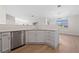 Modern kitchen with white shaker cabinets, stainless steel appliances, and an island at 2050 N Los Feliz St # 133, Las Vegas, NV 89156