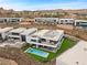 An elevated view of luxury homes with pools and landscaping on a hillside near walking paths at 21 Canyon Bay Dr, Henderson, NV 89011