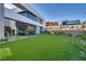 Expansive backyard with artificial turf and views of surrounding homes at 21 Canyon Bay Dr, Henderson, NV 89011