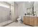 Modern bathroom with a glass-enclosed shower, sleek vanity, and contemporary fixtures at 21 Canyon Bay Dr, Henderson, NV 89011