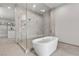 Bathroom with soaking tub and glass shower at 21 Canyon Bay Dr, Henderson, NV 89011