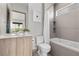 Modern bathroom featuring a single vanity, toilet, and shower-tub combo at 21 Canyon Bay Dr, Henderson, NV 89011