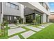 Private courtyard entry with modern landscaping and water feature at 21 Canyon Bay Dr, Henderson, NV 89011