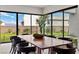 Beautiful dining room with modern chairs and large window showcasing the backyard at 21 Canyon Bay Dr, Henderson, NV 89011