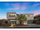 Modern two-story home with clean lines and a landscaped front yard at 21 Canyon Bay Dr, Henderson, NV 89011