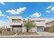 Modern home with attached two-car garage and desert landscaping at 21 Canyon Bay Dr, Henderson, NV 89011