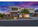 Modern home exterior at dusk, showcasing landscaping and architecture at 21 Canyon Bay Dr, Henderson, NV 89011