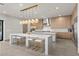 Modern kitchen with large island, stainless steel appliances, and light wood cabinets at 21 Canyon Bay Dr, Henderson, NV 89011