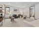 Modern living room featuring a stylish sofa, wire-frame chairs, and ample natural light at 21 Canyon Bay Dr, Henderson, NV 89011