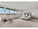 Bright main bedroom with large windows showcasing mountain views, stylish seating area, and luxe furnishings at 21 Canyon Bay Dr, Henderson, NV 89011