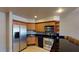 Modern kitchen with stainless steel appliances and wood cabinets at 211 E Flamingo Rd # 202, Las Vegas, NV 89169