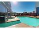 Relaxing rooftop pool with surrounding lounge chairs at 211 E Flamingo Rd # 202, Las Vegas, NV 89169