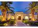 Elegant home exterior with palm trees and a grand entrance at 2200 Nordica Ct, Las Vegas, NV 89117