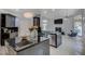 Open kitchen with a view into the living room, stainless steel appliances and modern design at 2200 Nordica Ct, Las Vegas, NV 89117