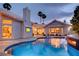 Luxury pool and spa with a fire feature and outdoor entertainment area at 2200 Nordica Ct, Las Vegas, NV 89117