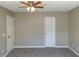 Neutral toned bedroom features a ceiling fan and carpet at 2420 Sweetgum St, Las Vegas, NV 89108