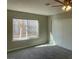 Bright bedroom with closet, window and cozy carpet at 2420 Sweetgum St, Las Vegas, NV 89108