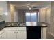 Well-lit kitchen featuring stainless steel sink, black dishwasher and lots of counter space at 2420 Sweetgum St, Las Vegas, NV 89108