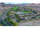 An aerial view of the community showcasing the golf course and lake at 25 Via Mantova # 2, Henderson, NV 89011