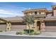 Charming two-story townhome featuring a beautiful tile roof and a two-car garage at 25 Via Mantova # 2, Henderson, NV 89011