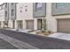 Row of townhouses showcasing modern design and individual entrances at 2795 Atomic Tangerine Way # 5, Las Vegas, NV 89183