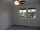 Bright bedroom with two windows and ceiling fan at 2838 Loveland Dr # 1619, Las Vegas, NV 89109